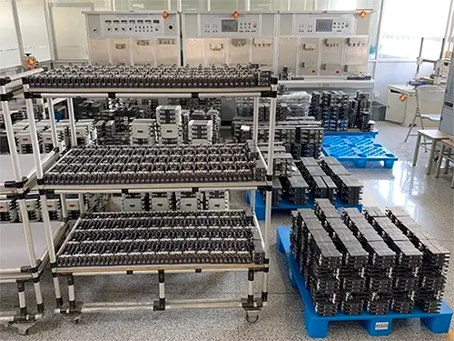 The temporary holding area in the testing room with inspected products stacked together.