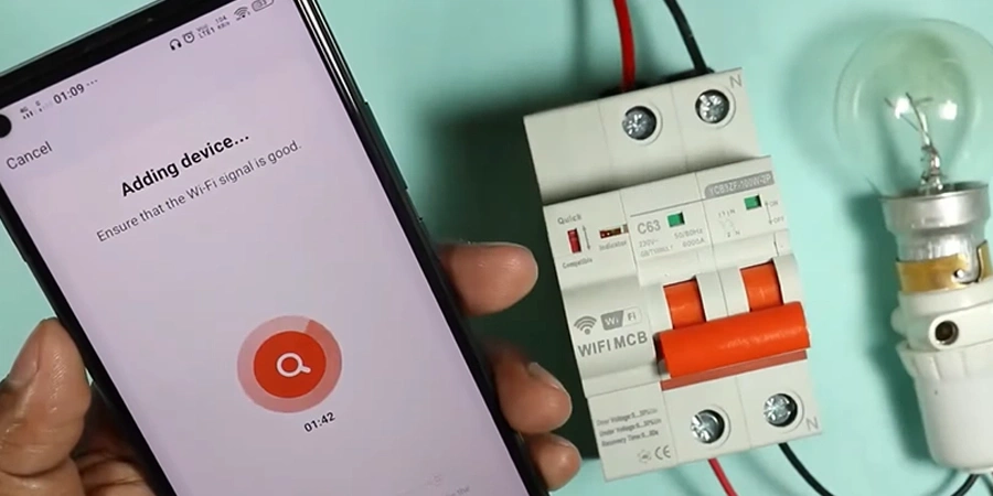 A hand holding a smartphone displaying a WiFi Circuit Breaker setup screen with a timer showing connection duration, next to a WiFi MCB smart circuit breaker labeled 'WiFi MCB' and a light bulb, illustrating the setup process for home.