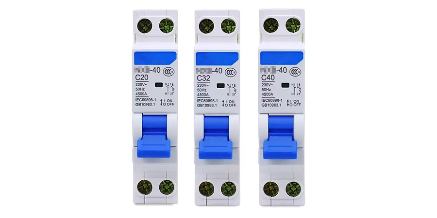 Three blue and white circuit breakers labeled C20-40, C32-40, and C40-40, with on/off switches and IEC60947-1 certification, arranged side by side.