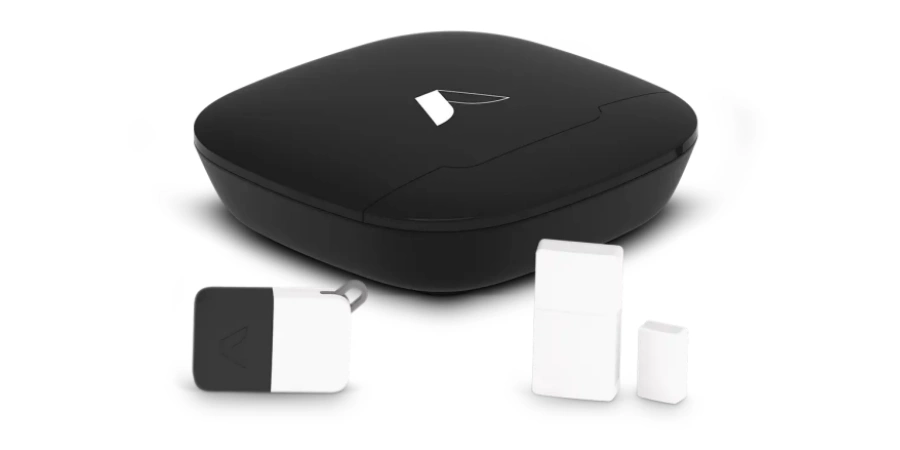Image of a black Abode Security Hub with a white logo, accompanied by one Mini Door/Window Sensor, and one black-and-white Keyfob with a clip.