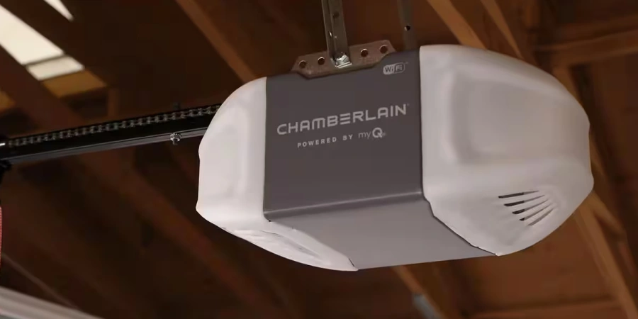 Image of a Chamberlain smart garage door opener with Wi-Fi capability, mounted on a ceiling with a track, powered by myQ technology.