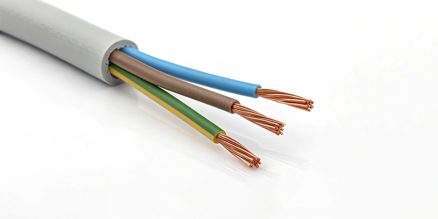 A stripped electrical wire revealing three differently colored internal wires: blue, green-yellow, and brown, with visible copper cores.