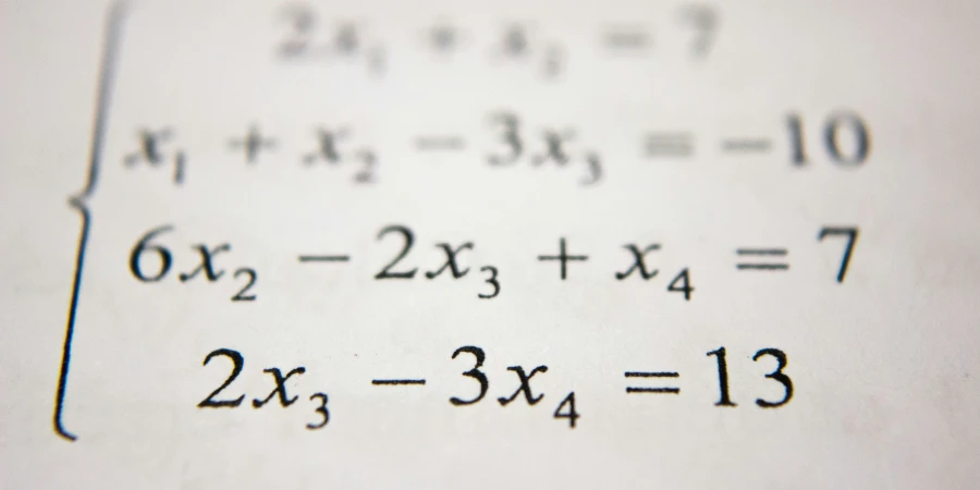 A handwritten system of linear equations on paper, consisting of four equations: 2x₁ + x₂ = 7, x₁ + x₂ - 3x₃ = -10, 6x₂ - 2x₃ + x₄ = 7, and 2x₃ - 3x₄ = 13.