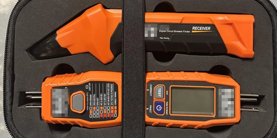 An orange digital circuit breaker finder set with a receiver and transmitter, stored in a black case, featuring a display and probe tips.