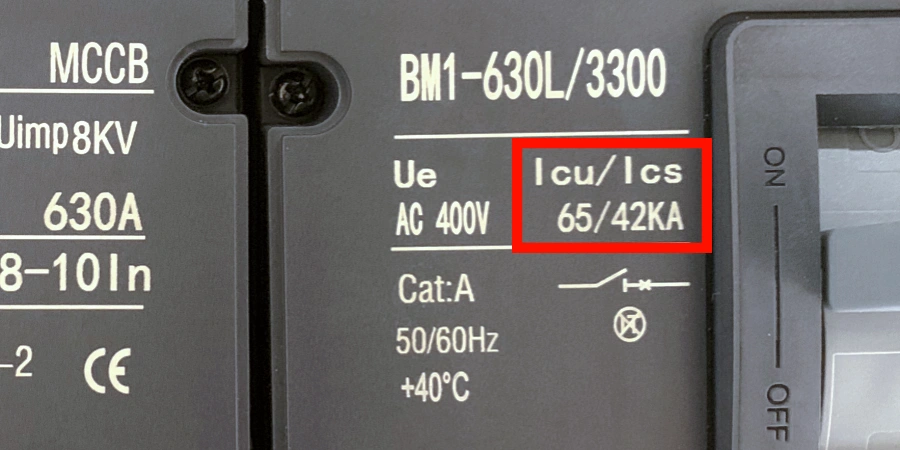 A molded case circuit breaker (MCCB) labeled BM1-630L/3300, showing specifications including 630A, 8-10 In, 400V Ue, and Cat:A with 50/60Hz and +40°C ratings. The Icu/Ics rating is highlighted in red, indicating 03/42kA, with an ON/OFF switch on the right side.