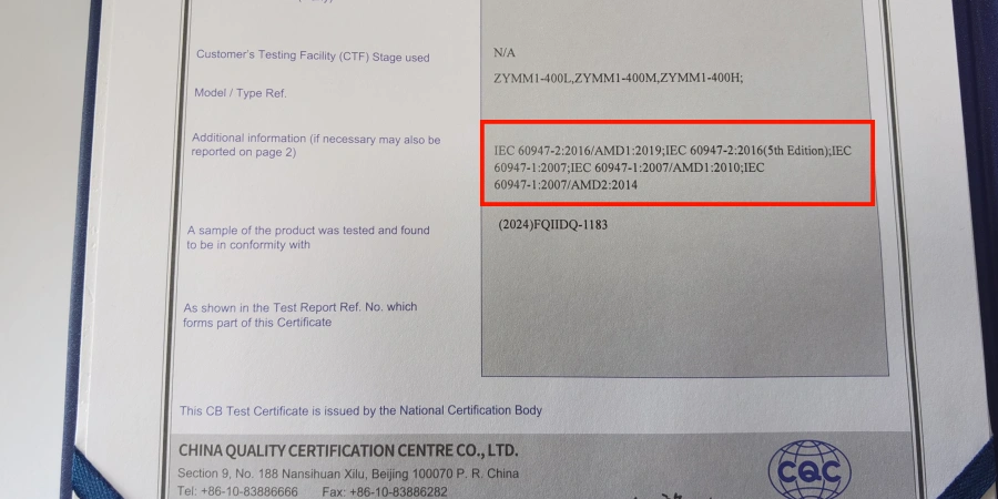 A close-up of an IECEE CB test certificate issued by China Quality Certification Centre, showing model references ZYMM1-400L, ZYMM1-400M, ZYMM1-400H. A red box highlights compliance with IEC 60947-2:2016 (including amendments) and related standards for molded case circuit breakers.