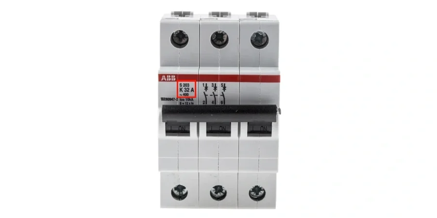 A white three-pole ABB S203 circuit breaker with black toggle switches in the on position. The red ABB logo is on top, and the label shows model 'S203', 'K 32 A' indicating Type K tripping curve, rated for 32 amps, with 6kA breaking capacity.